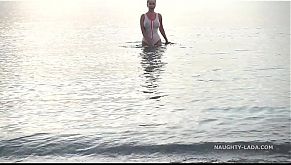 Wet transparent swimsuit in public